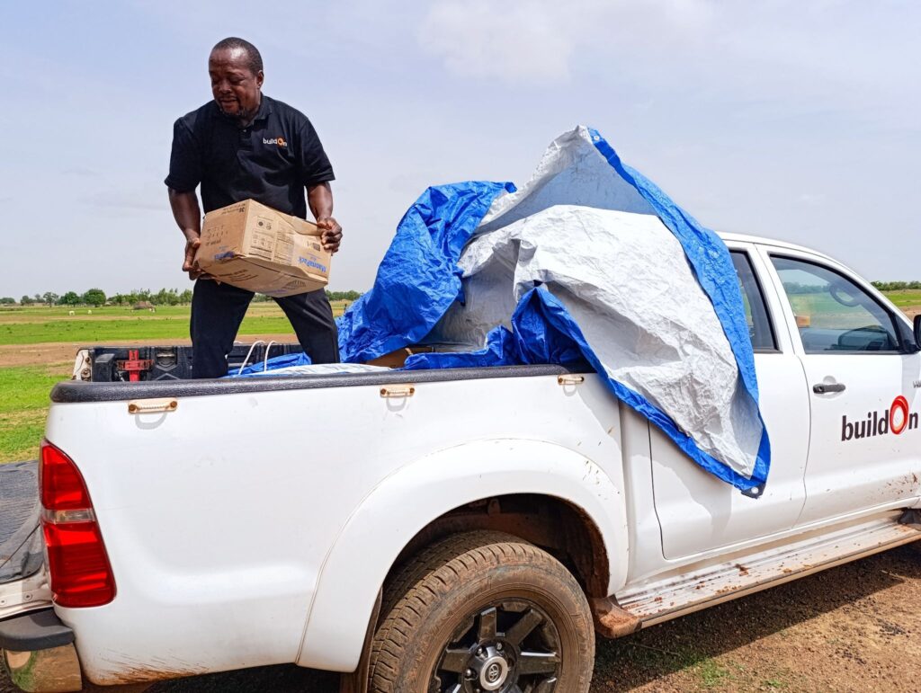 buildOn staff drop off food in Toebanega, Burkina Faso.