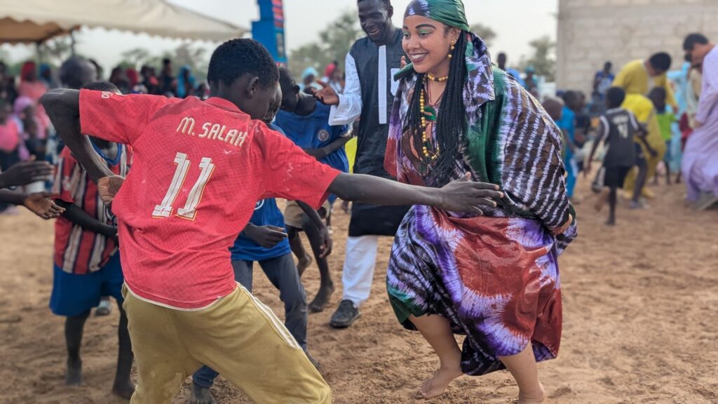 Students wore traditional Senegalese clothing and danced with community members as part of the closing ceremony.