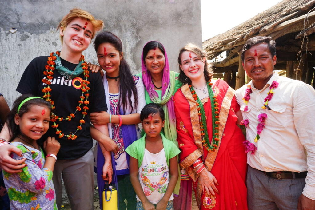 Trek participants from Lower Merion High School with their host family in Nepal.