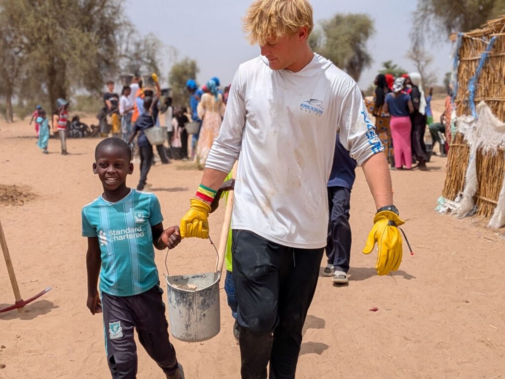 A student from the Sarasota High School Trek Team at the worksite in Tawa Fall-Diourbel, Senegal.