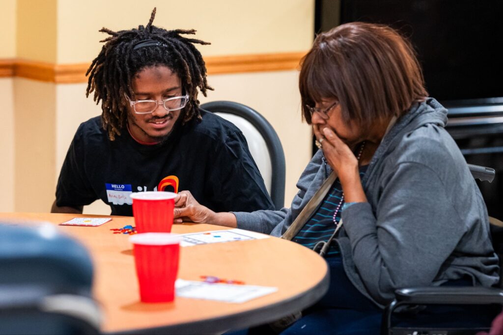 A buildOn student serves with seniors at RYZE West in Chicago.