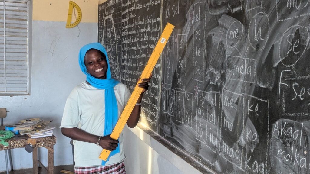 Aissatou at the blackboard in her Adult Literacy class.