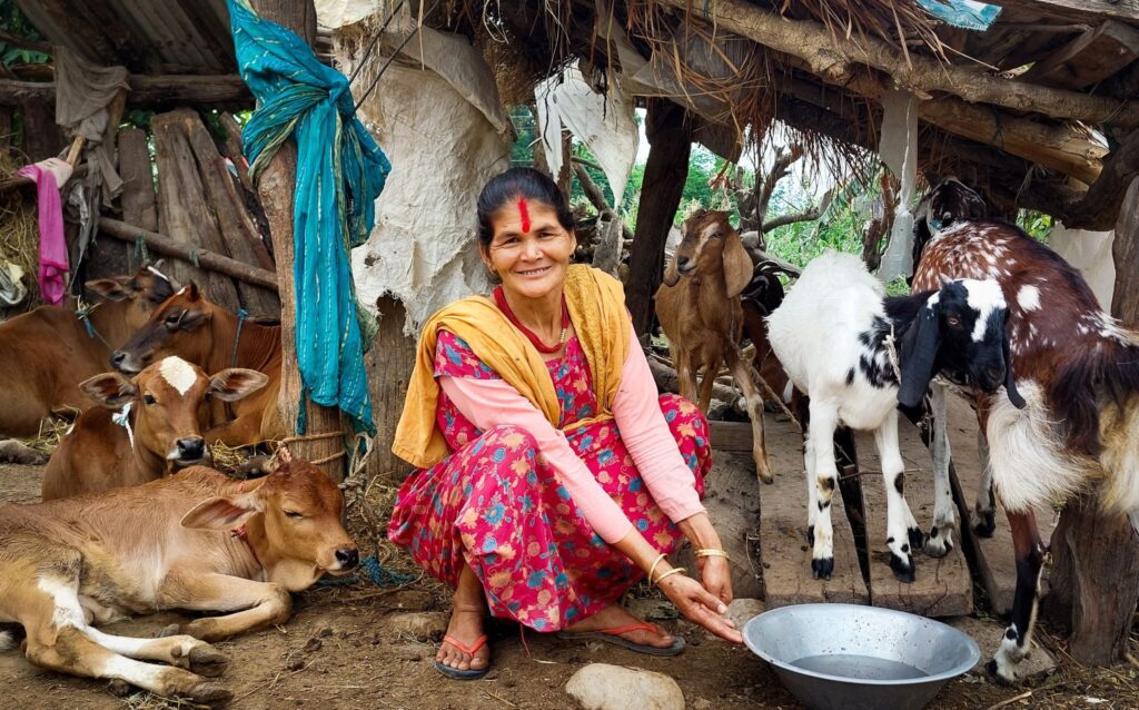 An Adult Literacy participant in Jonapur, Nepal practices animal husbandry as part of buildOn’s income-generating activities program.
