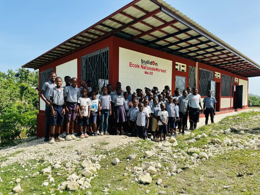 Students in Morvant celebrate outside of their brand-new buildOn school.