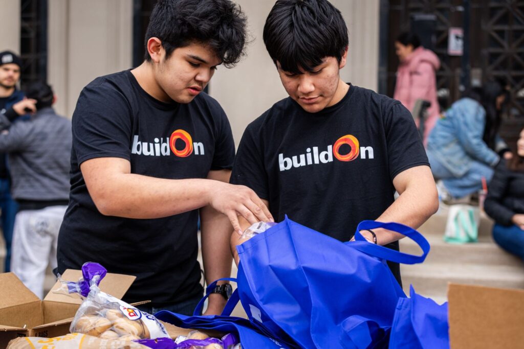 buildOn students in Chicago distribute food with the Zakat Foundation.