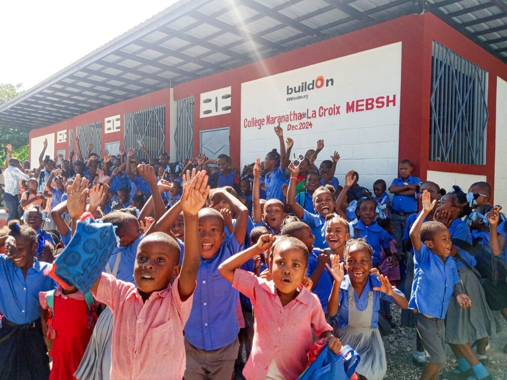 Students celebrate their new school in La Croix, Haiti.
