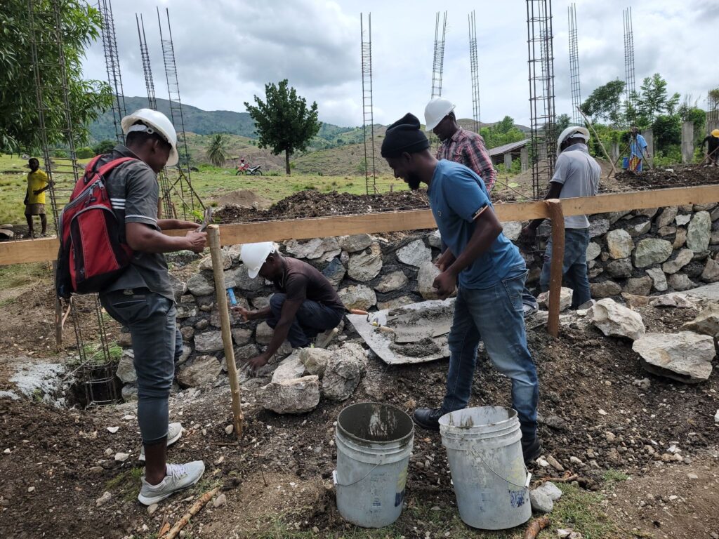 The people of Conde contributed 1,029 volunteer workdays to build their new school.