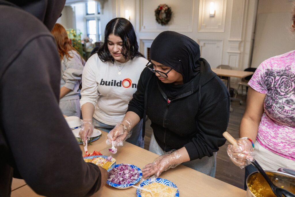 buildOn students from the Bronx and Bridgeport help serve food at Harrison Apartments in Bridgeport, CT.