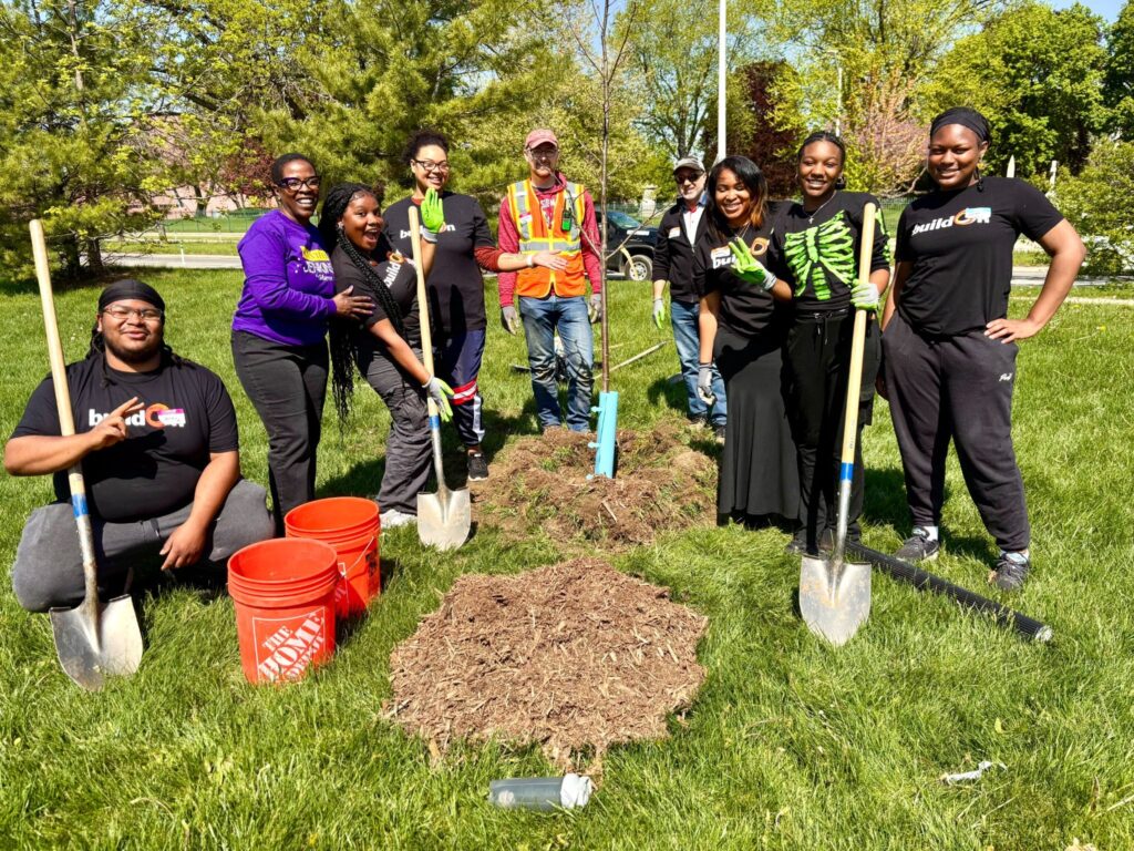 buildOn students in Detroit help plant trees at King High School.