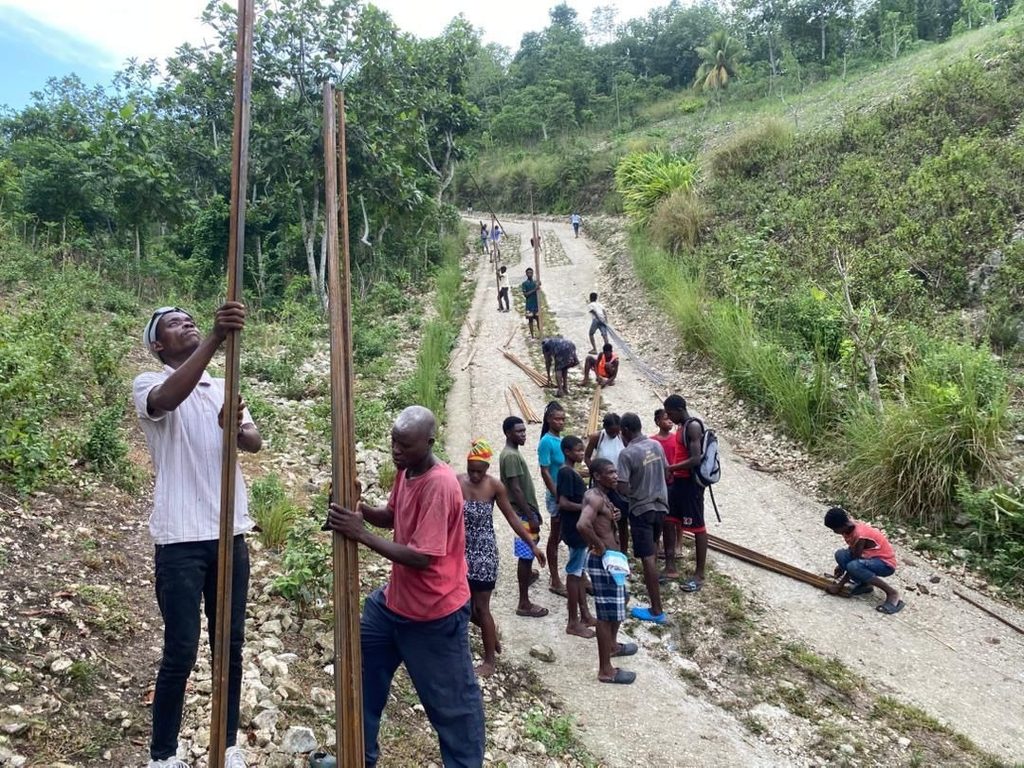 Community members used wooden planks to reinforce the road. 