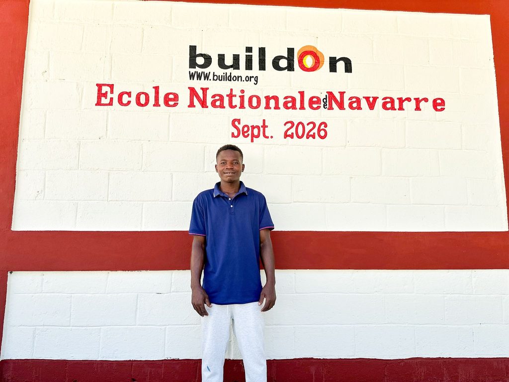 Bellevice Michelson in front of the school he helped build.