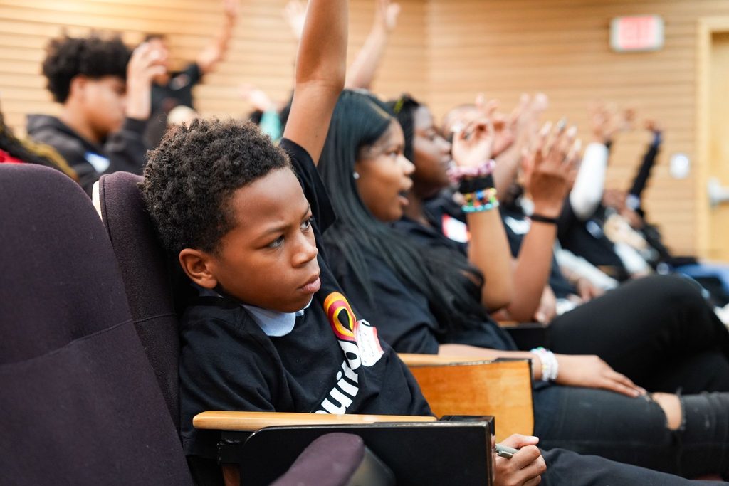 Students ask questions at buildOn in Detroit’s legislator forum. 